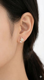 young woman wearing gold-plated hypoallergenic earrings, showing their anti-tarnish shine suitable for sensitive skin and daily wear