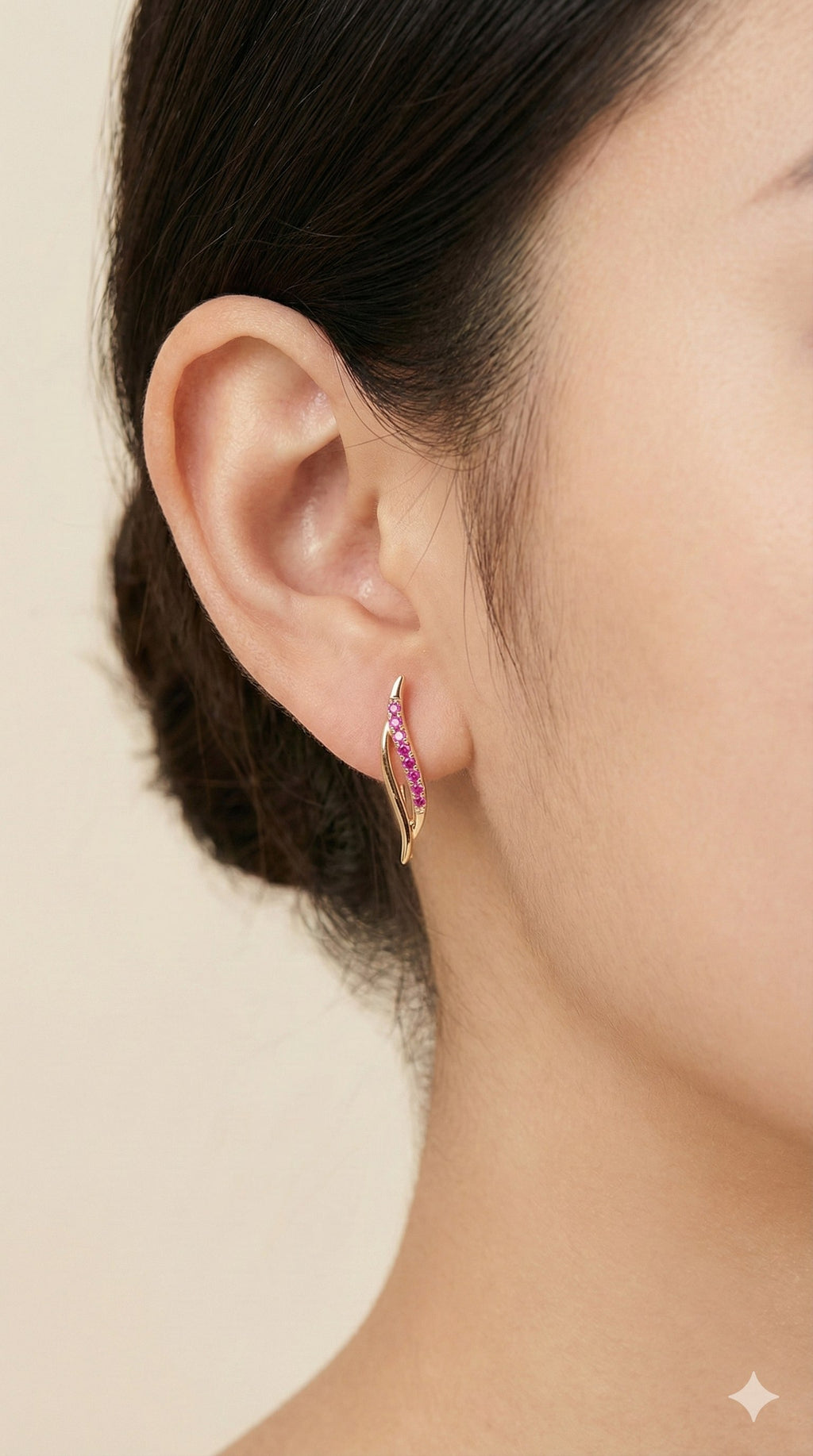 young woman wearing gold-plated hypoallergenic earrings, showing their anti-tarnish shine suitable for sensitive skin and daily wear