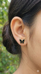 young woman wearing gold-plated hypoallergenic earrings, showing their anti-tarnish shine suitable for sensitive skin and daily wear