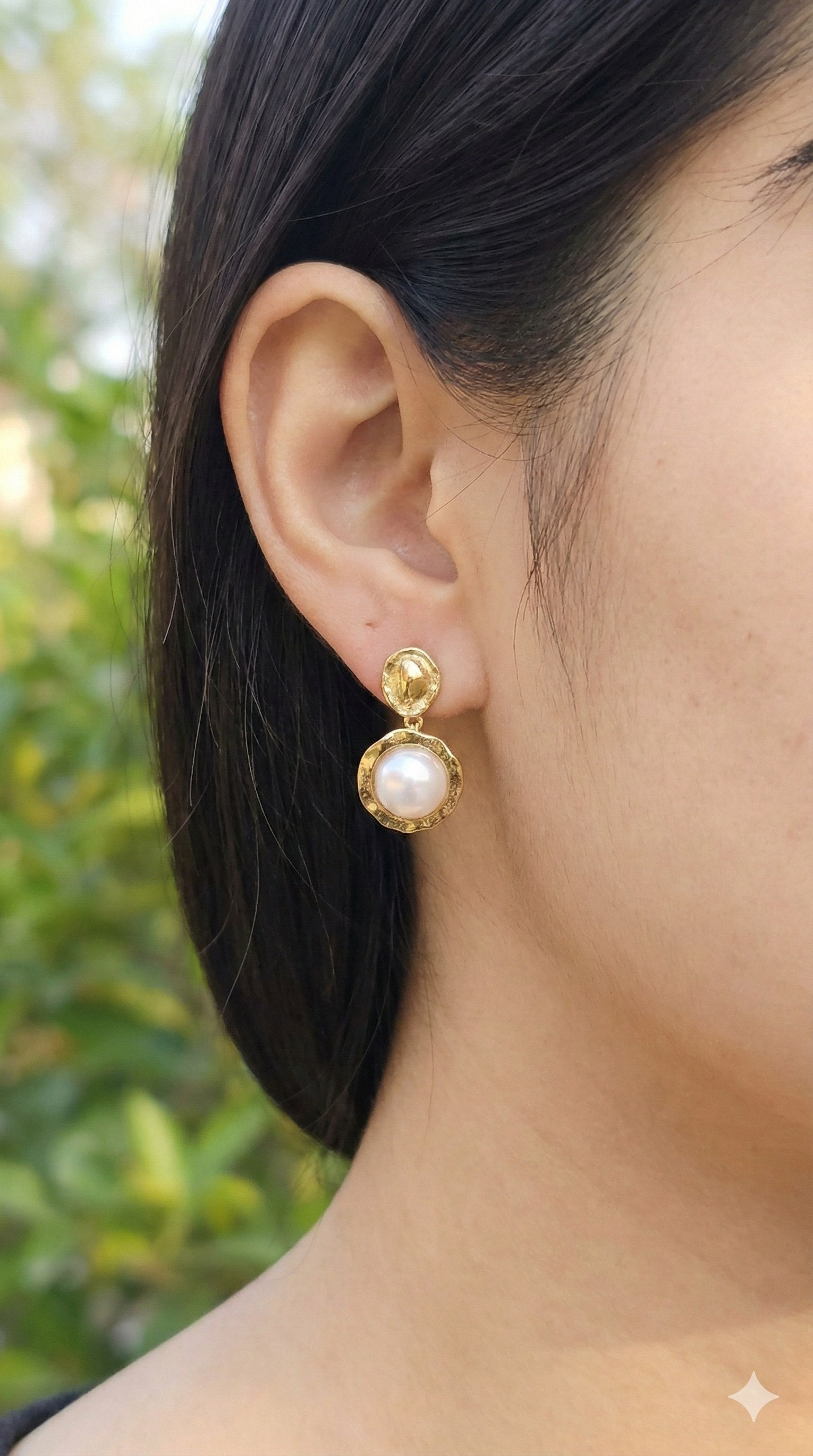 young woman wearing gold-plated hypoallergenic earrings, showing their anti-tarnish shine suitable for sensitive skin and daily wear