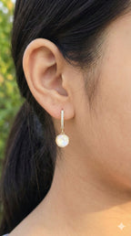 young woman wearing gold-plated hypoallergenic earrings, showing their anti-tarnish shine suitable for sensitive skin and daily wear