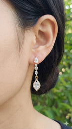 young woman wearing gold-plated hypoallergenic earrings, showing their anti-tarnish shine suitable for sensitive skin and daily wear