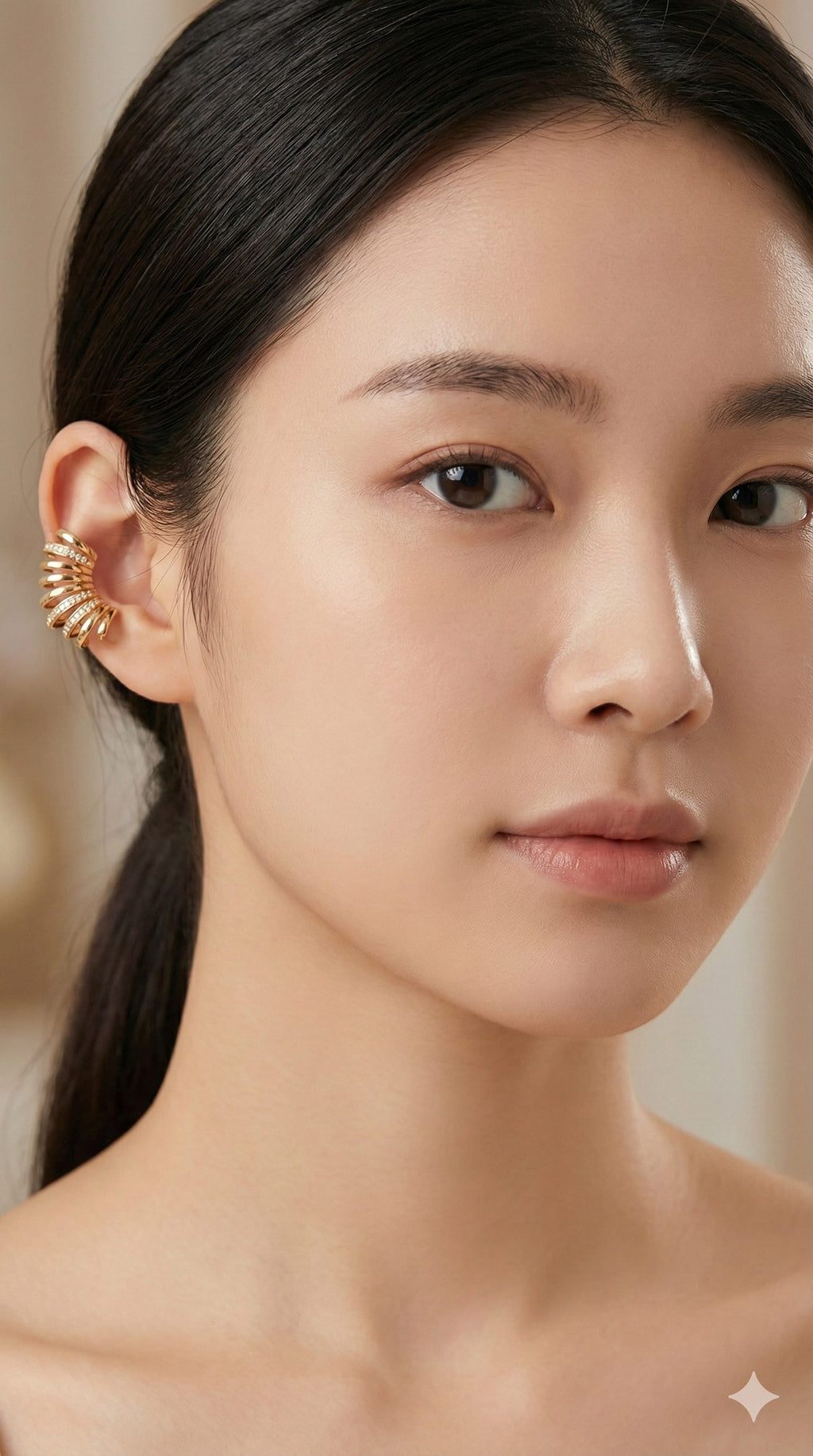young woman wearing gold-plated hypoallergenic earrings, showing their anti-tarnish shine suitable for sensitive skin and daily wear