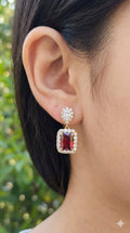 young woman wearing gold-plated hypoallergenic earrings, showing their anti-tarnish shine suitable for sensitive skin and daily wear