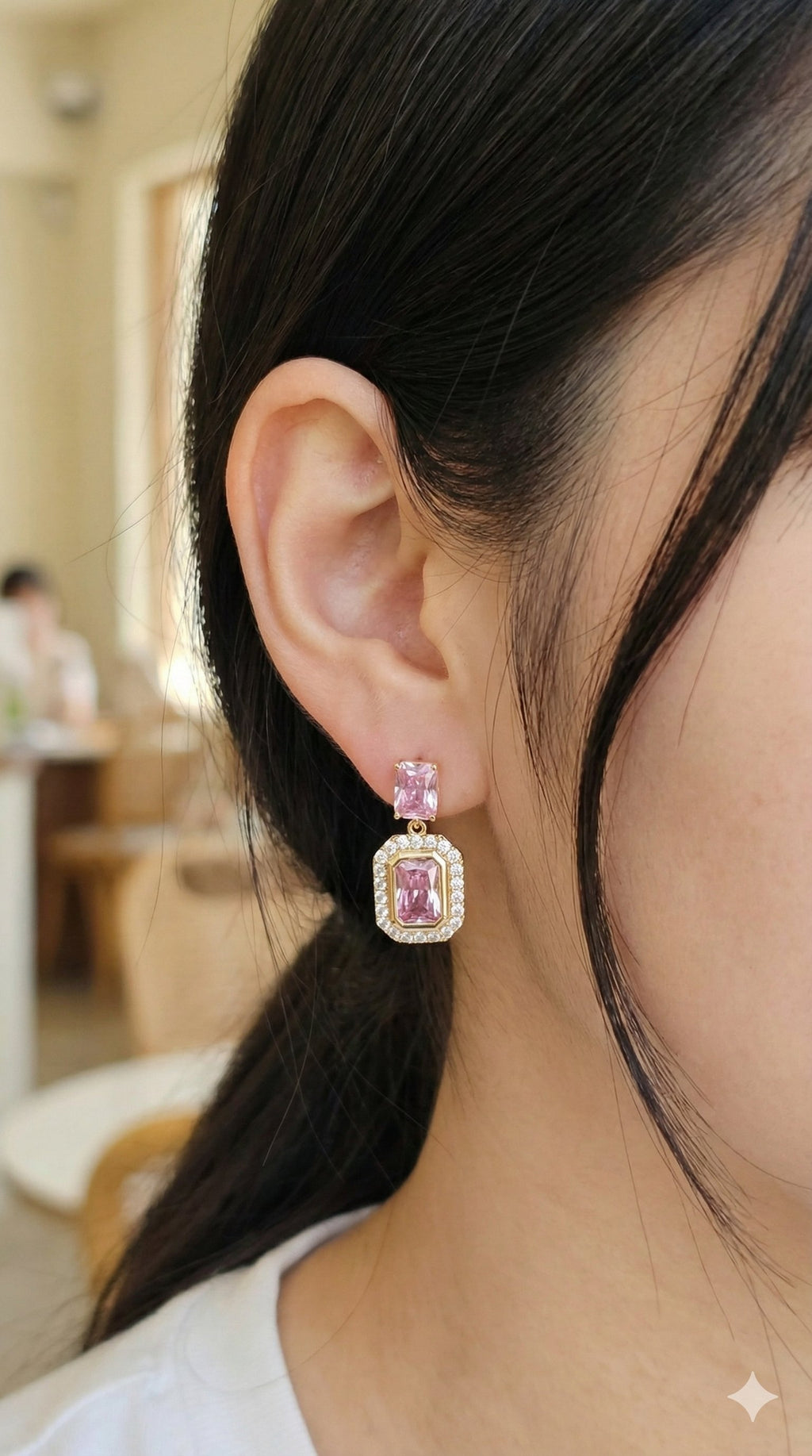 young woman wearing gold-plated hypoallergenic earrings, showing their anti-tarnish shine suitable for sensitive skin and daily wear