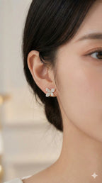 young woman wearing gold-plated hypoallergenic earrings, showing their anti-tarnish shine suitable for sensitive skin and daily wear