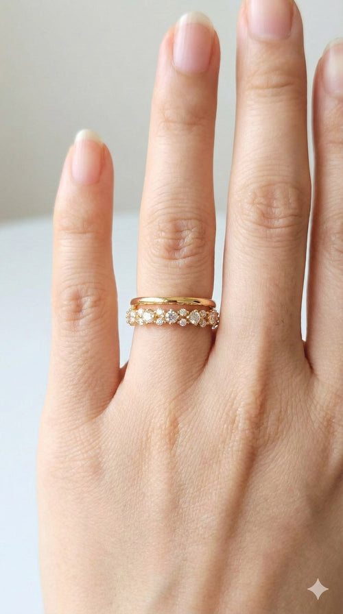 young woman wearing gold-plated hypoallergenic finger ring, showing their anti-tarnish shine suitable for sensitive skin and daily wear