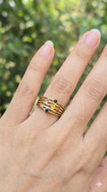 young woman wearing gold-plated hypoallergenic finger ring, showing their anti-tarnish shine suitable for sensitive skin and daily wear