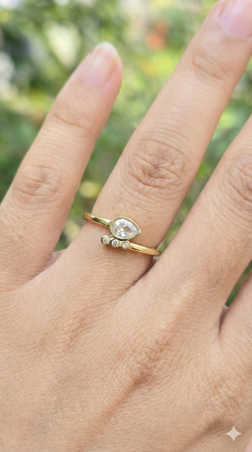 young woman wearing gold-plated hypoallergenic finger ring, showing their anti-tarnish shine suitable for sensitive skin and daily wear
