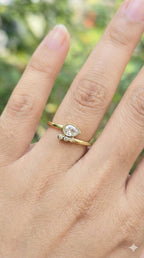 young woman wearing gold-plated hypoallergenic finger ring, showing their anti-tarnish shine suitable for sensitive skin and daily wear