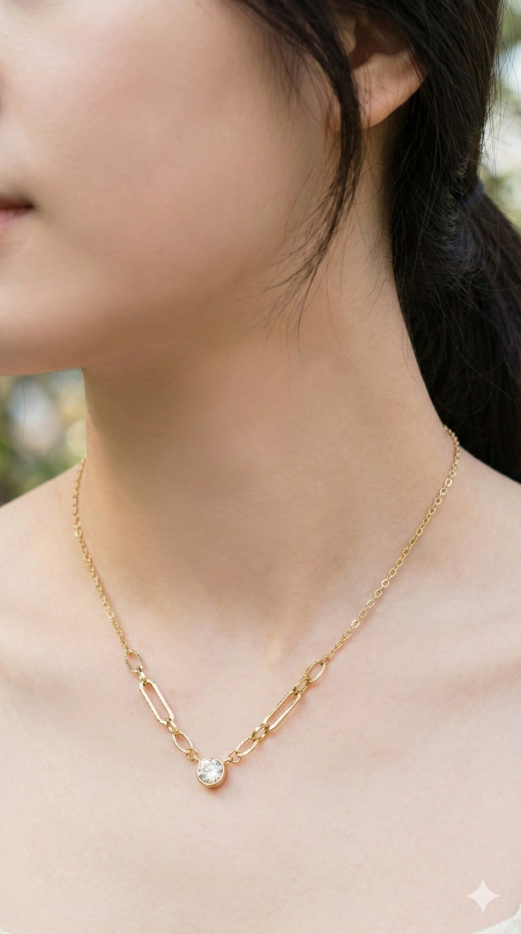 young woman wearing gold-plated hypoallergenic necklace, showing their anti-tarnish shine suitable for sensitive skin and daily wear