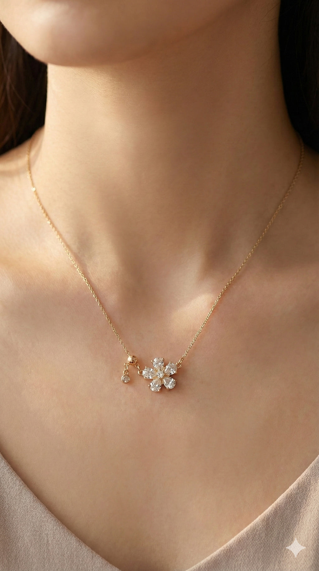 young woman wearing gold-plated hypoallergenic necklace, showing their anti-tarnish shine suitable for sensitive skin and daily wear