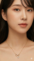 young woman wearing gold-plated hypoallergenic necklace, showing their anti-tarnish shine suitable for sensitive skin and daily wear