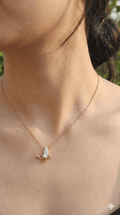 young woman wearing gold-plated hypoallergenic necklace, showing their anti-tarnish shine suitable for sensitive skin and daily wear