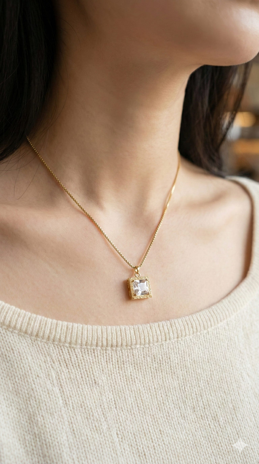 young woman wearing gold-plated hypoallergenic necklace, showing their anti-tarnish shine suitable for sensitive skin and daily wear