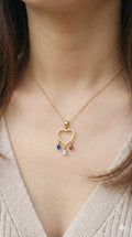 young woman wearing gold-plated hypoallergenic necklace, showing their anti-tarnish shine suitable for sensitive skin and daily wear