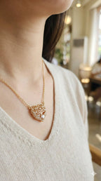 young woman wearing gold-plated hypoallergenic necklace, showing their anti-tarnish shine suitable for sensitive skin and daily wear