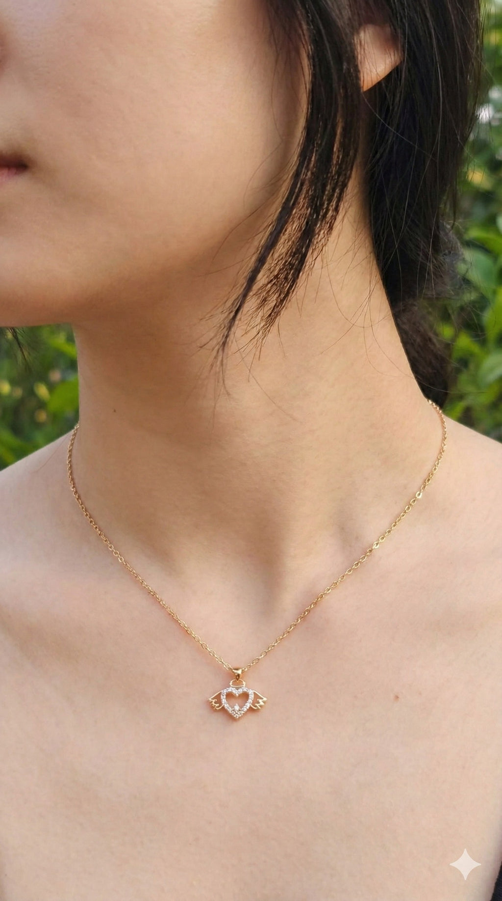 young woman wearing gold-plated hypoallergenic necklace, showing their anti-tarnish shine suitable for sensitive skin and daily wear