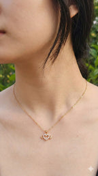 young woman wearing gold-plated hypoallergenic necklace, showing their anti-tarnish shine suitable for sensitive skin and daily wear