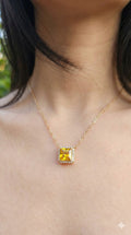 young woman wearing gold-plated hypoallergenic necklace, showing their anti-tarnish shine suitable for sensitive skin and daily wear