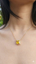 young woman wearing gold-plated hypoallergenic necklace, showing their anti-tarnish shine suitable for sensitive skin and daily wear