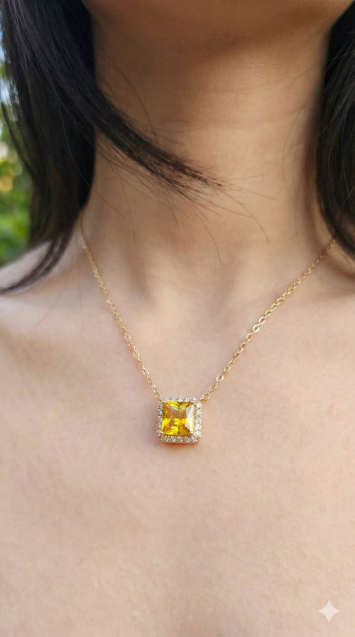 young woman wearing gold-plated hypoallergenic necklace, showing their anti-tarnish shine suitable for sensitive skin and daily wear