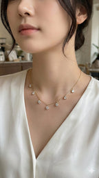 young woman wearing gold-plated hypoallergenic necklace, showing their anti-tarnish shine suitable for sensitive skin and daily wear