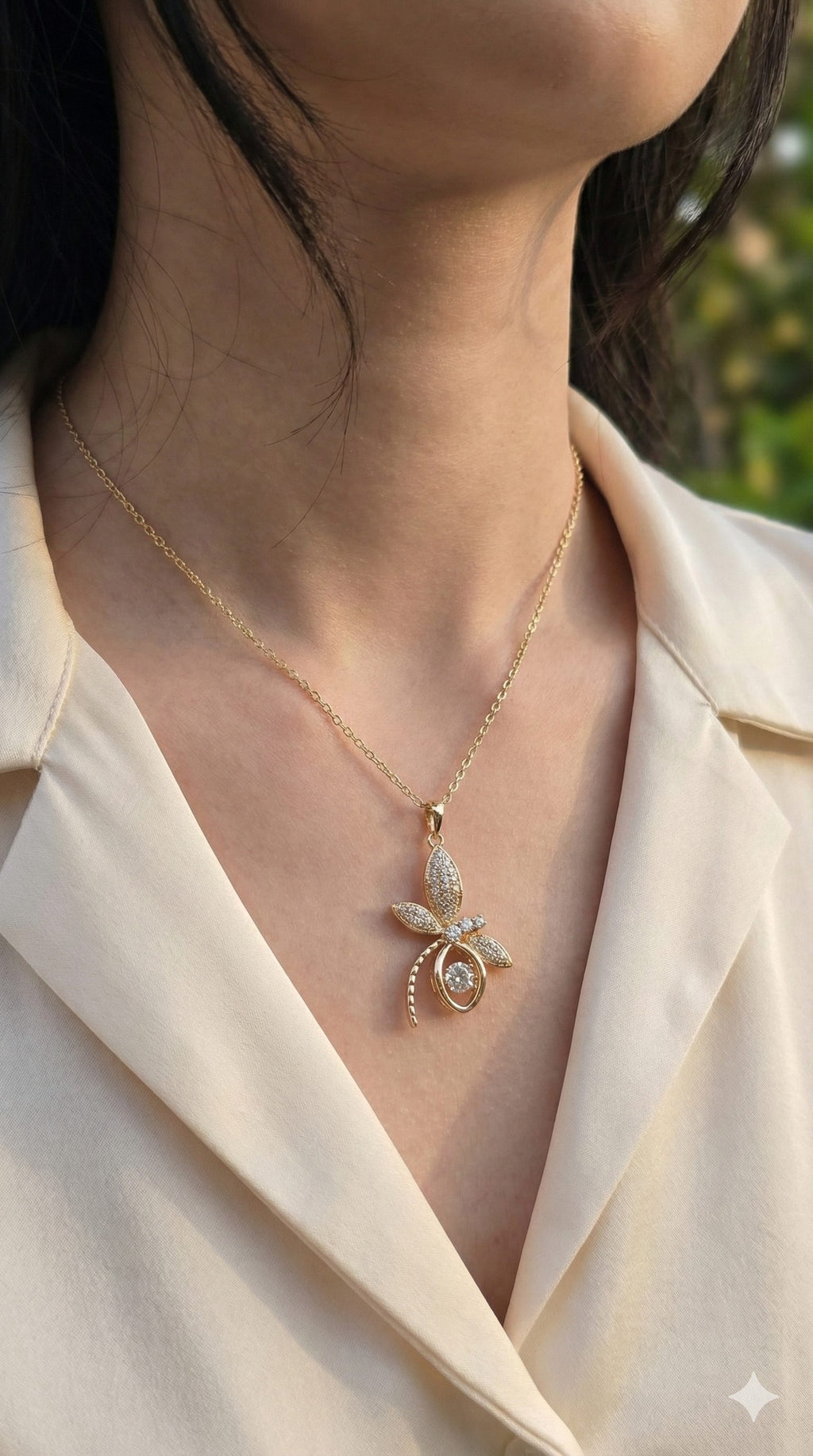 young woman wearing gold-plated hypoallergenic necklace, showing their anti-tarnish shine suitable for sensitive skin and daily wear