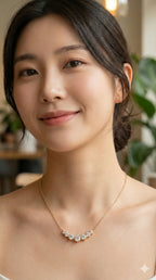 young woman wearing gold-plated hypoallergenic necklace, showing their anti-tarnish shine suitable for sensitive skin and daily wear
