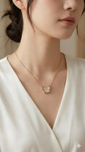 young woman wearing gold-plated hypoallergenic necklace, showing their anti-tarnish shine suitable for sensitive skin and daily wear
