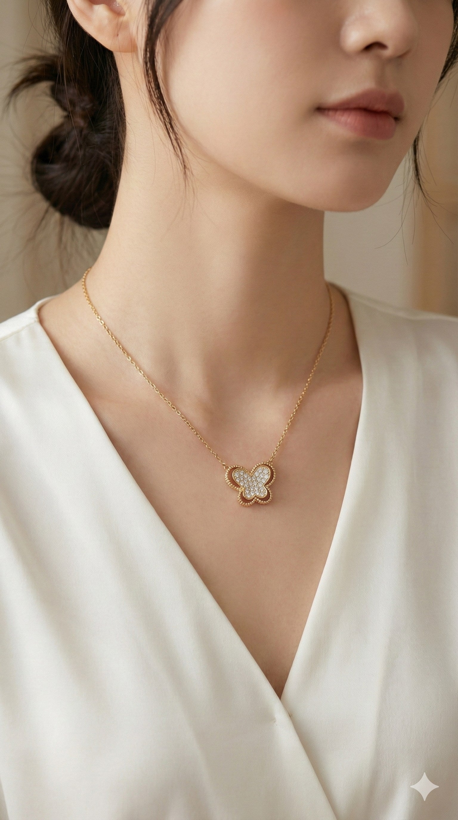 young woman wearing gold-plated hypoallergenic necklace, showing their anti-tarnish shine suitable for sensitive skin and daily wear