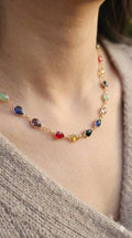 young woman wearing gold-plated hypoallergenic necklace, showing their anti-tarnish shine suitable for sensitive skin and daily wear