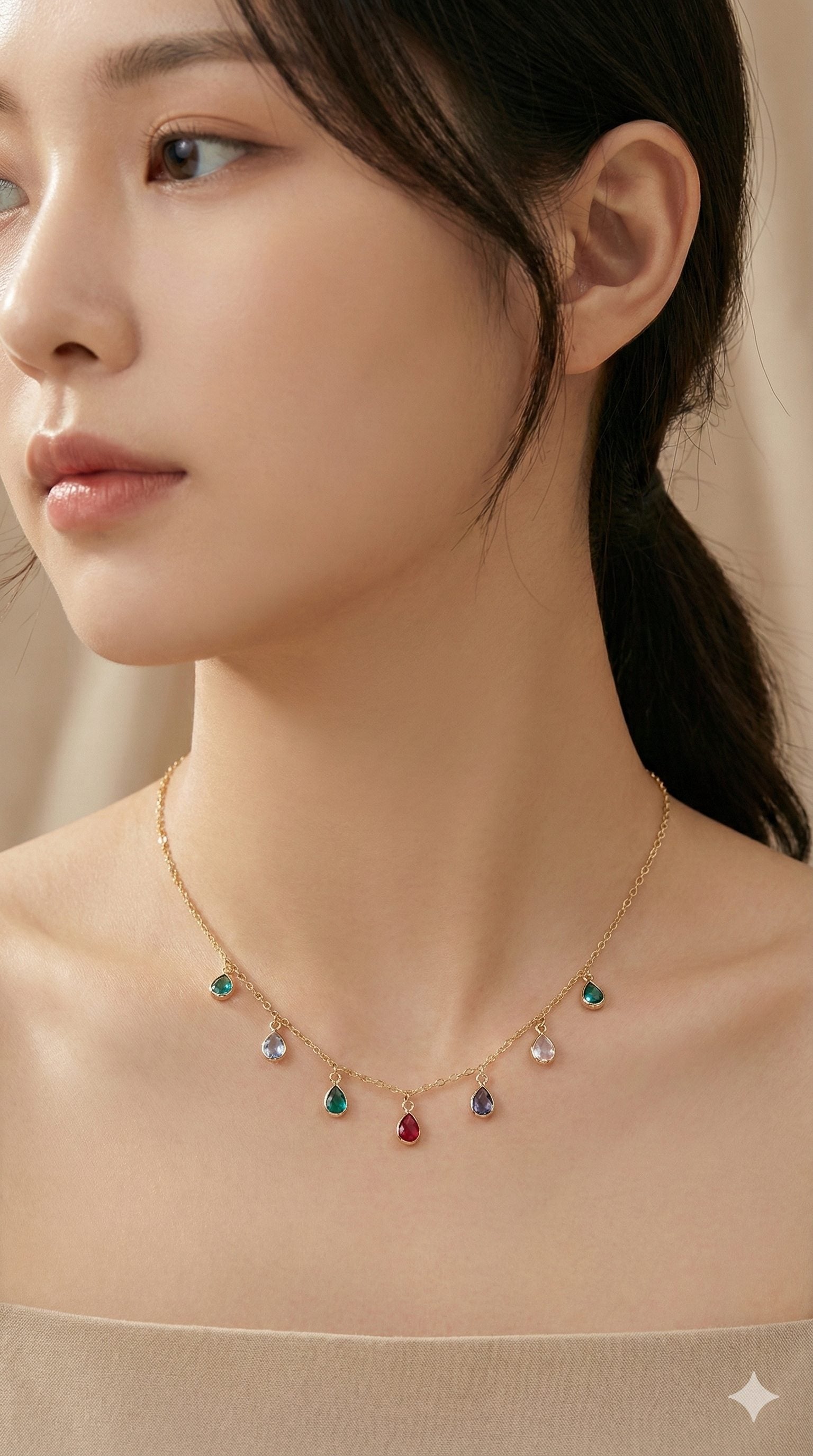 young woman wearing gold-plated hypoallergenic necklace, showing their anti-tarnish shine suitable for sensitive skin and daily wear