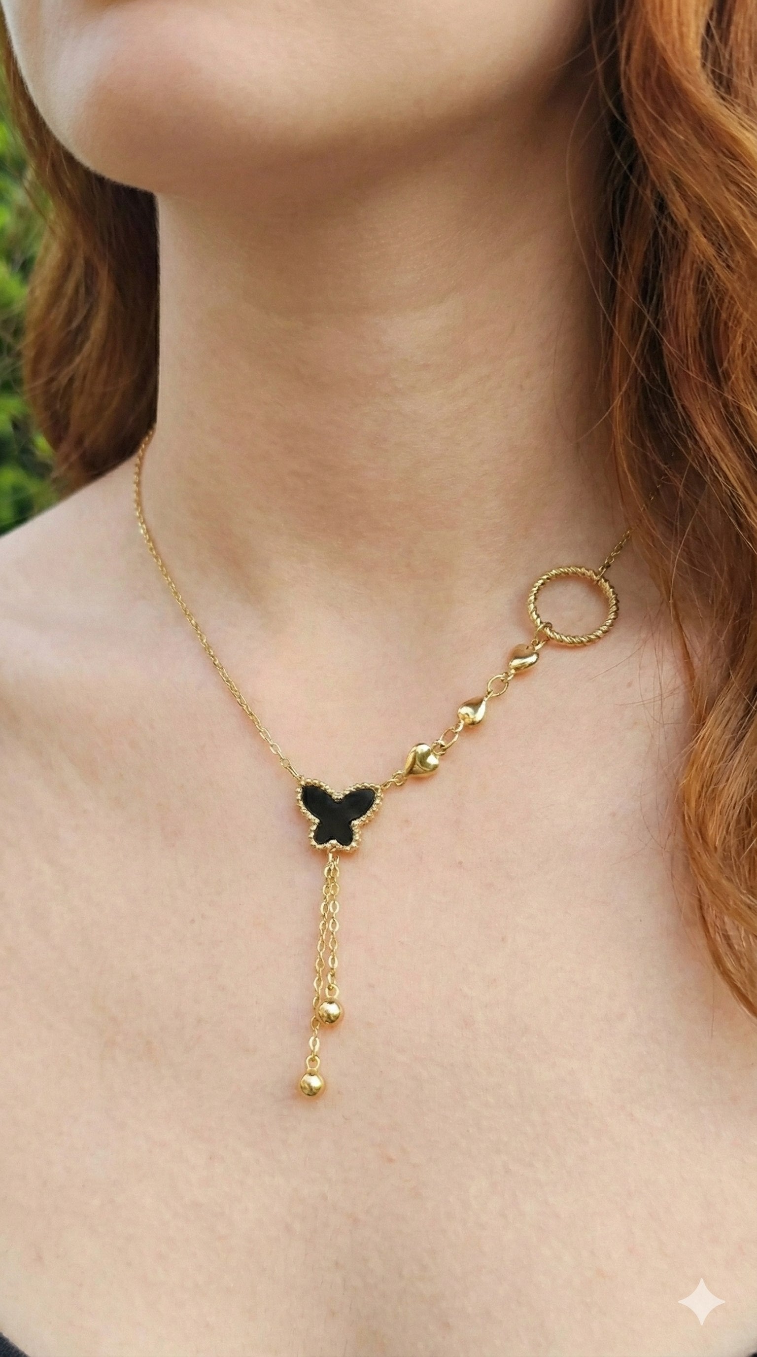 young woman wearing gold-plated hypoallergenic necklace, showing their anti-tarnish shine suitable for sensitive skin and daily wear