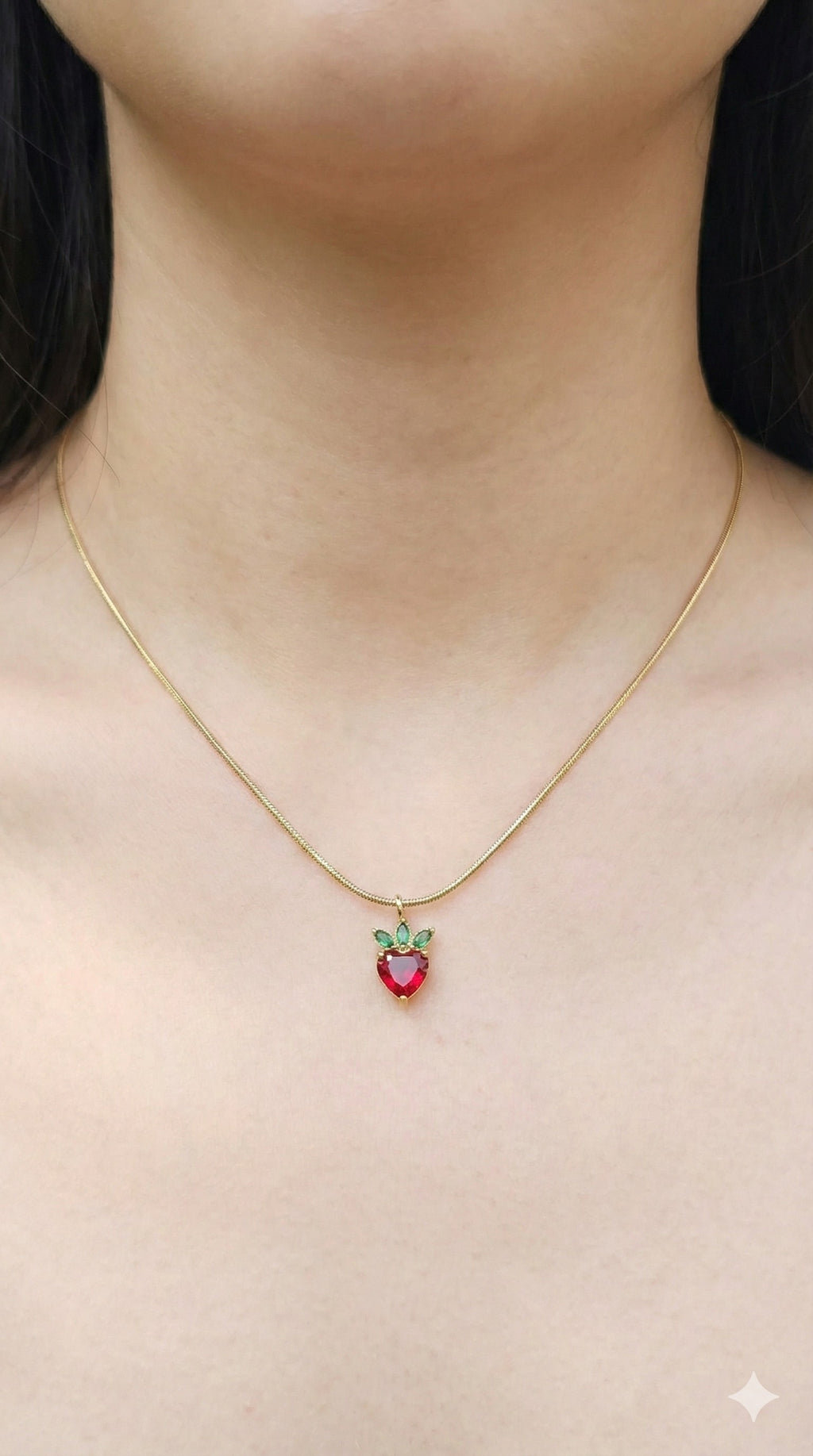 young woman wearing gold-plated hypoallergenic necklace, showing their anti-tarnish shine suitable for sensitive skin and daily wear