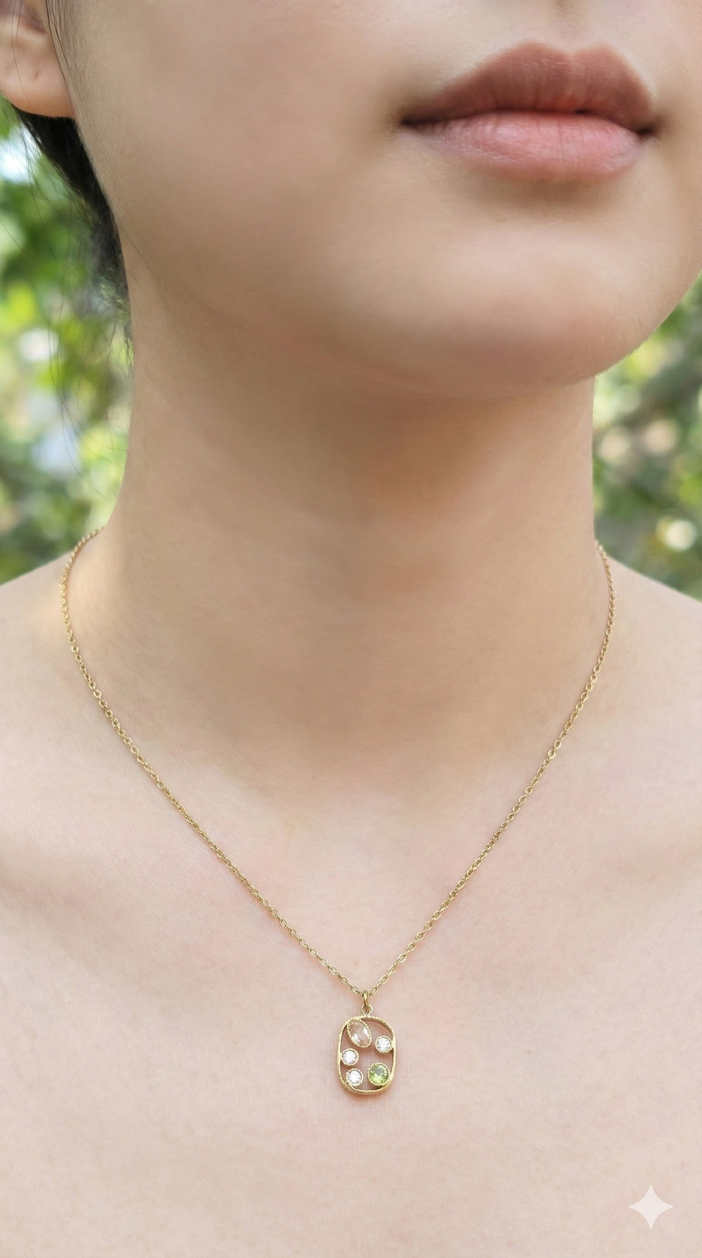 young woman wearing gold-plated hypoallergenic necklace, showing their anti-tarnish shine suitable for sensitive skin and daily wear