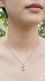 young woman wearing gold-plated hypoallergenic necklace, showing their anti-tarnish shine suitable for sensitive skin and daily wear