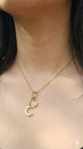 young woman wearing gold-plated hypoallergenic necklace, showing their anti-tarnish shine suitable for sensitive skin and daily wear