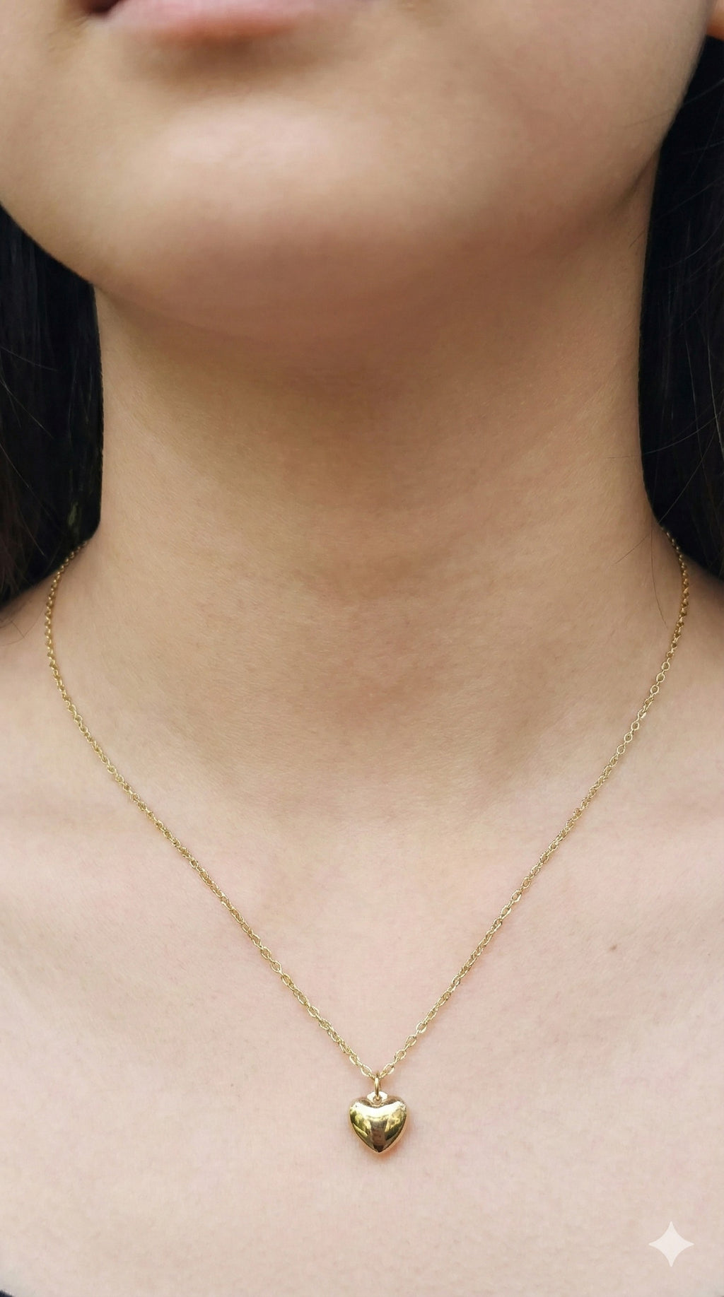 young woman wearing gold-plated hypoallergenic necklace, showing their anti-tarnish shine suitable for sensitive skin and daily wear