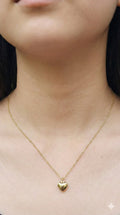 young woman wearing gold-plated hypoallergenic necklace, showing their anti-tarnish shine suitable for sensitive skin and daily wear