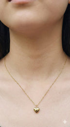 young woman wearing gold-plated hypoallergenic necklace, showing their anti-tarnish shine suitable for sensitive skin and daily wear
