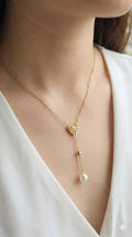 young woman wearing gold-plated hypoallergenic necklace, showing their anti-tarnish shine suitable for sensitive skin and daily wear
