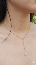 young woman wearing gold-plated hypoallergenic necklace, showing their anti-tarnish shine suitable for sensitive skin and daily wear