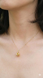young woman wearing gold-plated hypoallergenic necklace, showing their anti-tarnish shine suitable for sensitive skin and daily wear