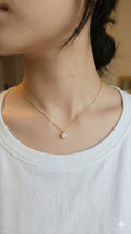young woman wearing gold-plated hypoallergenic necklace, showing their anti-tarnish shine suitable for sensitive skin and daily wear