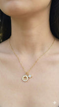 young woman wearing gold-plated hypoallergenic necklace, showing their anti-tarnish shine suitable for sensitive skin and daily wear