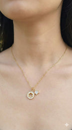 young woman wearing gold-plated hypoallergenic necklace, showing their anti-tarnish shine suitable for sensitive skin and daily wear