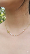 young woman wearing gold-plated hypoallergenic necklace, showing their anti-tarnish shine suitable for sensitive skin and daily wear