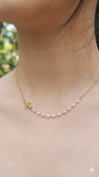 young woman wearing gold-plated hypoallergenic necklace, showing their anti-tarnish shine suitable for sensitive skin and daily wear