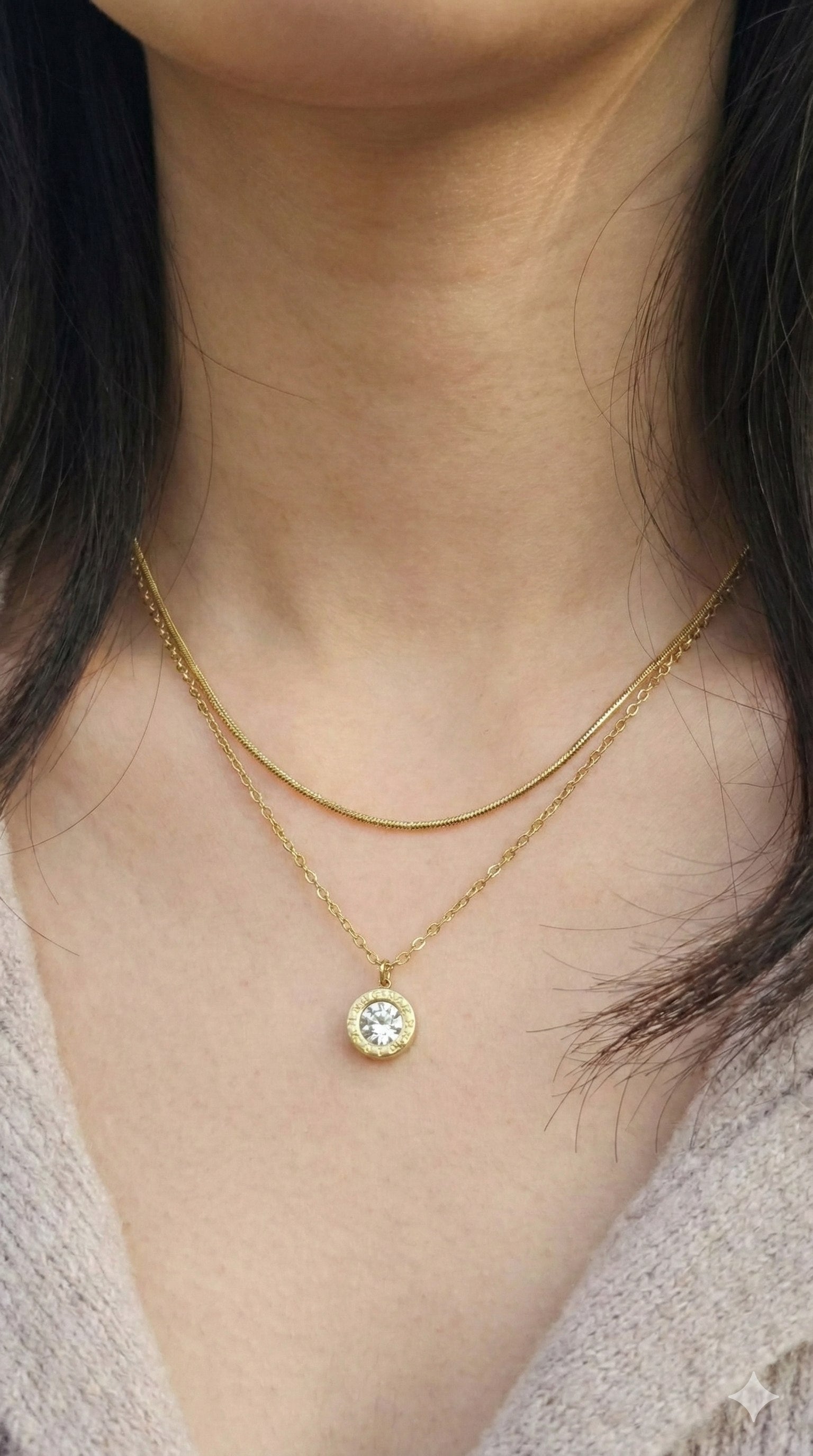 young woman wearing gold-plated hypoallergenic necklace, showing their anti-tarnish shine suitable for sensitive skin and daily wear